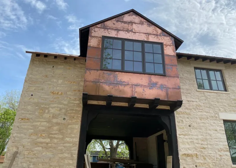 Copper metal panel facade on a stone building for Roof Repair in Key West