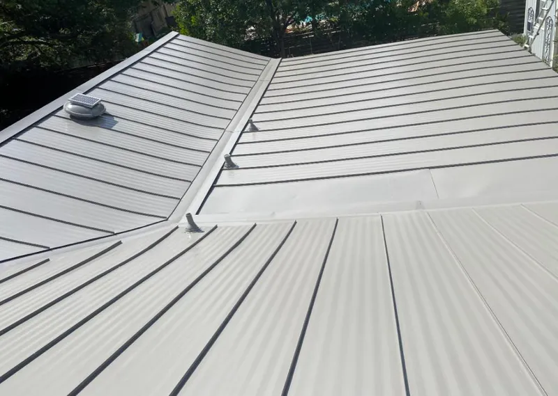 Solar attic fan installed on a metal roof for Roof Ventilation in Key West
